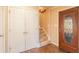 Lovely foyer with stone flooring, closet, staircase, and decorative front door at 165 Carriage Gate Dr, Sharpsburg, GA 30277