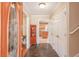 Warm and welcoming foyer featuring slate floors, coat closets, and a view into the adjacent kitchen at 165 Carriage Gate Dr, Sharpsburg, GA 30277