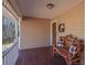 Cozy covered front porch features a wooden bench, creating a comfortable and inviting entrance at 165 Carriage Gate Dr, Sharpsburg, GA 30277
