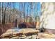 Outdoor stone grill with brick floors and sink situated in a beautiful wooded setting at 165 Carriage Gate Dr, Sharpsburg, GA 30277