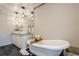 Luxurious bathroom with a soaking tub, double vanity, and modern lighting fixtures at 249 The South Chace Ne, Atlanta, GA 30328