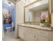 Bathroom featuring neutral walls, marble countertops, and adjacent toilet and shower area at 249 The South Chace Ne, Atlanta, GA 30328