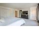 Spacious bedroom featuring and closets, dresser, tv, and neutral carpet at 249 The South Chace Ne, Atlanta, GA 30328