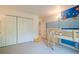 Shared bedroom featuring bunk beds, themed wall decor, and a closet at 249 The South Chace Ne, Atlanta, GA 30328