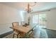 Cozy dining area with rustic table, bench seating, and sliding glass door at 249 The South Chace Ne, Atlanta, GA 30328