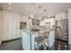 Bright kitchen with white cabinetry, marble counters, stainless appliances, and center island at 249 The South Chace Ne, Atlanta, GA 30328