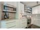 Bright kitchen featuring stainless steel appliances, white cabinets, and grey subway tile backsplash at 249 The South Chace Ne, Atlanta, GA 30328