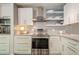 Modern kitchen featuring white cabinets, stainless steel appliances, and open shelving at 249 The South Chace Ne, Atlanta, GA 30328