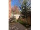 Cozy brick patio area featuring a small table set, artificial turf, and a wooden privacy fence at 249 The South Chace Ne, Atlanta, GA 30328