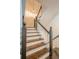 Elegant staircase with dark wood treads, white risers, and a decorative pendant light at 249 The South Chace Ne, Atlanta, GA 30328