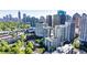 Beautiful aerial shot showcasing property surrounded by trees, with the city skyline in the distance at 275 13Th Ne St # 903, Atlanta, GA 30309
