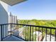Overlooking treetops and city buildings, this balcony features black metal railings that add a sleek aesthetic at 275 13Th Ne St # 903, Atlanta, GA 30309