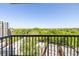 Enjoy the view from this balcony, with black metal railings overlooking lush treetops and city buildings at 275 13Th Ne St # 903, Atlanta, GA 30309