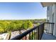 Enjoy the view of treetops and city buildings from this balcony, complete with black metal railings at 275 13Th Ne St # 903, Atlanta, GA 30309