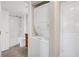 Practical bathroom area with a stacked washer and dryer, alongside a full bathroom with a tub and shower at 275 13Th Ne St # 903, Atlanta, GA 30309