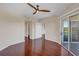 Lovely bedroom featuring hardwood floors, ceiling fan, and balcony access at 275 13Th Ne St # 903, Atlanta, GA 30309