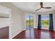 Comfortable bedroom with hardwood floors, fan, balcony access, and ample space at 275 13Th Ne St # 903, Atlanta, GA 30309