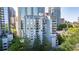 Beautiful exterior view of an apartment building with trees surrounding the building at 275 13Th Ne St # 903, Atlanta, GA 30309