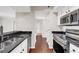 Kitchen leads into the hallway with hardwood flooring and a door leading to other rooms at 275 13Th Ne St # 903, Atlanta, GA 30309