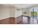 Bright living room features hardwood floors, natural light, and access to the balcony at 275 13Th Ne St # 903, Atlanta, GA 30309