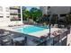 Enjoy the community's pool with sun loungers for relaxing and entertaining guests, next to lush landscaping at 275 13Th Ne St # 903, Atlanta, GA 30309