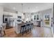 Modern kitchen featuring stainless steel appliances, a granite island with bar seating, and hardwood floors at 306 Oldvine Dr, Lawrenceville, GA 30044