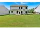 Expansive backyard with a lush lawn and an attractive two-story house with large windows at 376 Waterbluff Dr, Mableton, GA 30126