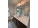 Bright bathroom featuring a marble countertop, stylish vanity, and a well-lit mirror at 376 Waterbluff Dr, Mableton, GA 30126