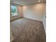 Spacious bedroom with plush carpet and a large window to enhance natural light at 376 Waterbluff Dr, Mableton, GA 30126
