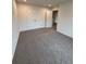 Cozy bedroom featuring neutral carpeting and ample closet space for storage at 376 Waterbluff Dr, Mableton, GA 30126
