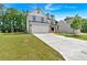 Beautiful two-story home with a two-car garage and an extra-long driveway and landscaped front yard at 376 Waterbluff Dr, Mableton, GA 30126