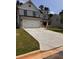 Charming home showcasing a brick and siding facade, a two-car garage and a driveway at 376 Waterbluff Dr, Mableton, GA 30126