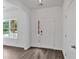 Bright entryway featuring hard surface floors, white walls, and craftsman-style trim and door at 376 Waterbluff Dr, Mableton, GA 30126