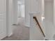 Upstairs hallway with carpeted floors and view into nearby bedroom at 376 Waterbluff Dr, Mableton, GA 30126