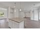 Kitchen island featuring gray countertop and views into the home's multiple living spaces at 376 Waterbluff Dr, Mableton, GA 30126