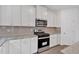 A kitchen features stainless steel appliances and white cabinets and hardware at 376 Waterbluff Dr, Mableton, GA 30126