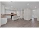 A bright kitchen features an island, pendant lights, stainless appliances, and hard surface floors at 376 Waterbluff Dr, Mableton, GA 30126