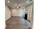 Cozy living room with ceiling fan, a fireplace, and large windows overlooking a yard at 376 Waterbluff Dr, Mableton, GA 30126