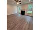 Spacious living room has a fireplace, large windows, and new flooring at 376 Waterbluff Dr, Mableton, GA 30126