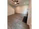 Open living room features hardwood floors, a ceiling fan and a fireplace at 376 Waterbluff Dr, Mableton, GA 30126