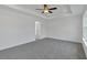 Main bedroom featuring recessed lighting, ceiling fan, large windows, and neutral-colored carpet at 376 Waterbluff Dr, Mableton, GA 30126