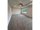 Spacious main bedroom with carpet, tray ceiling and a ceiling fan at 376 Waterbluff Dr, Mableton, GA 30126