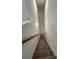 Carpeted staircase with handrail leads to the upper level of the home at 376 Waterbluff Dr, Mableton, GA 30126