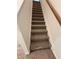 Carpeted staircase leads to the upper level of the home at 376 Waterbluff Dr, Mableton, GA 30126