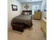 Cozy bedroom featuring a queen bed, neutral tones, and a decorative wall piece at 1302 Speckle Park Way, Stockbridge, GA 30281