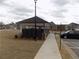 Community picnic pavilion surrounded by residences and ample parking, showcasing a welcoming space at 1302 Speckle Park Way, Stockbridge, GA 30281