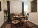 Cozy dining area with stylish chairs, a round table, and elegant decor at 1302 Speckle Park Way, Stockbridge, GA 30281