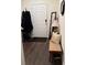 Welcoming entryway features hardwood floors, a bench, a mirror, and a coat rack at 1302 Speckle Park Way, Stockbridge, GA 30281