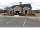 Community building featuring a stone facade and well-maintained landscaping at 1302 Speckle Park Way, Stockbridge, GA 30281
