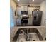 Well-equipped kitchen with granite countertops, stainless appliances, and ample storage at 1302 Speckle Park Way, Stockbridge, GA 30281